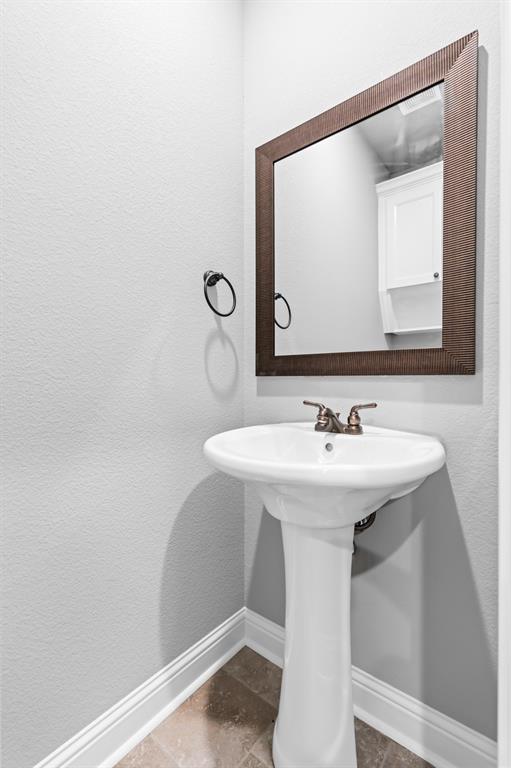 120 Water View Lane Robinson, TX 76706 - Photo 13 of 34 Half Bathroom featuring pedestal sink.