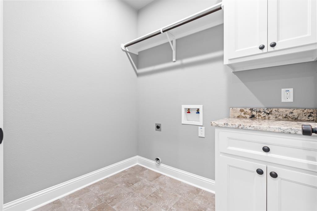 120 Water View Lane Robinson, TX 76706 - Photo 14 of 34 Washroom featuring cabinet space, electric dryer hookup, washer hookup, and baseboards