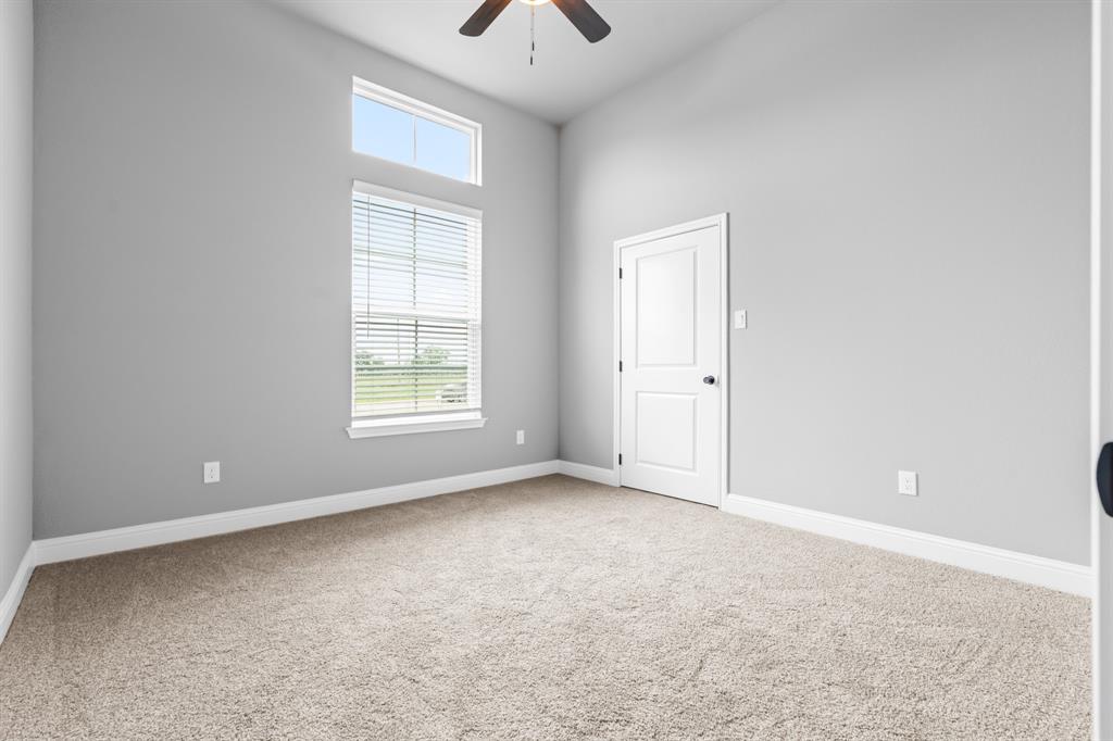 120 Water View Lane Robinson, TX 76706 - Photo 20 of 34 2nd bedroom featuring a healthy amount of sunlight.