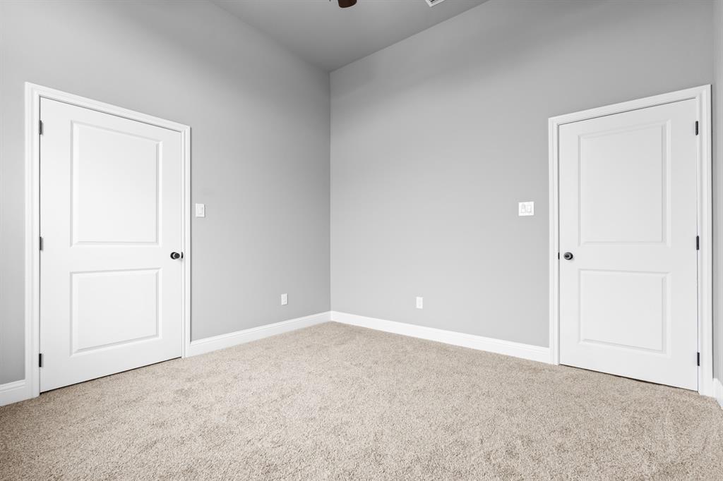 120 Water View Lane Robinson, TX 76706 - Photo 21 of 34 2nd Bedroom with ceiling fan & spacious closet.