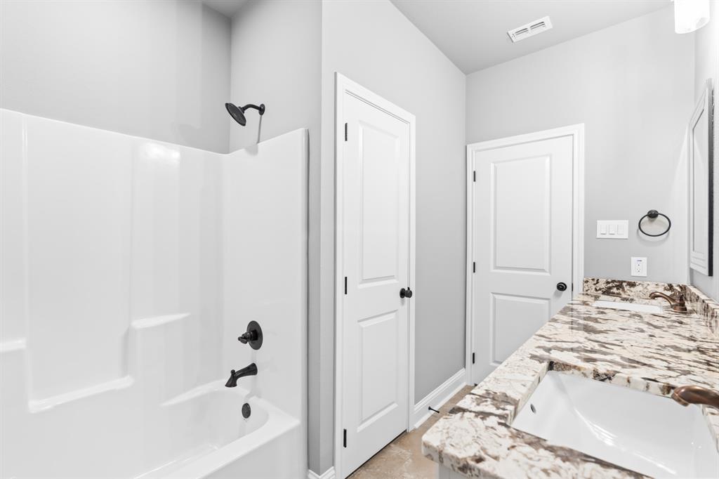 120 Water View Lane Robinson, TX 76706 - Photo 27 of 34 Full hall bathroom with vanity, and shower / tub combination