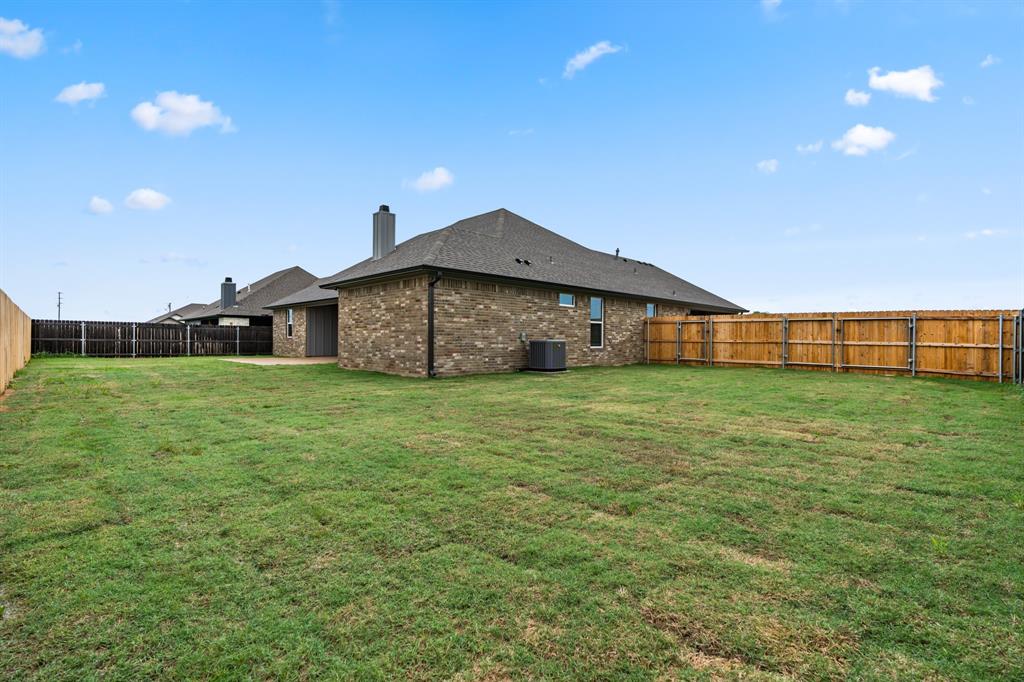 120 Water View Lane Robinson, TX 76706 - Photo 29 of 34 View of yard with a fenced backyard.