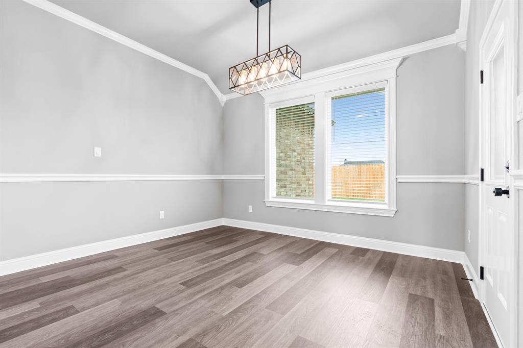 120 Water View Lane Robinson, TX 76706 - Photo 7 of 34 Dining room with dark wood finished floors, a chandelier, baseboards, and ornamental molding