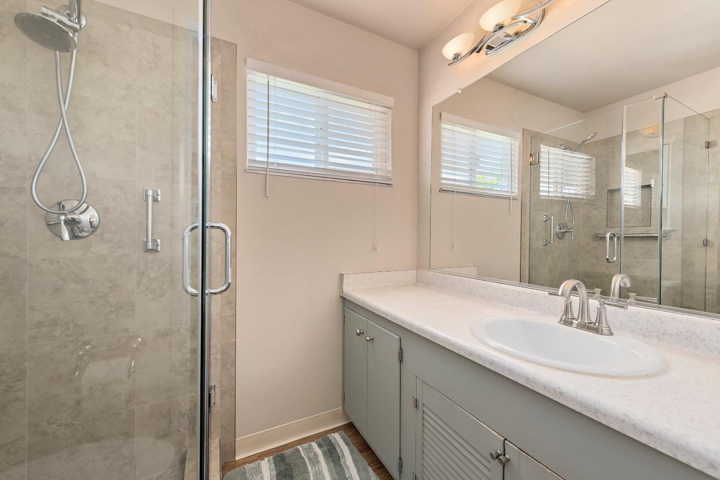 1471 Inskip Drive Campbell, CA 95008 - Photo 14 of 21 a bathroom with a sink and a mirror