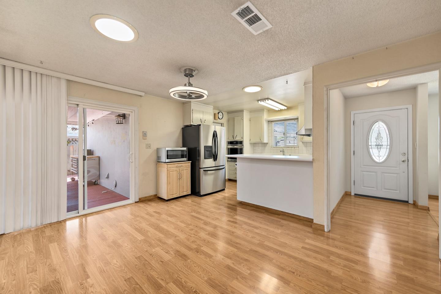 1471 Inskip Drive Campbell, CA 95008 - Photo 6 of 21 a view of a kitchen with wooden floor and electronic appliances