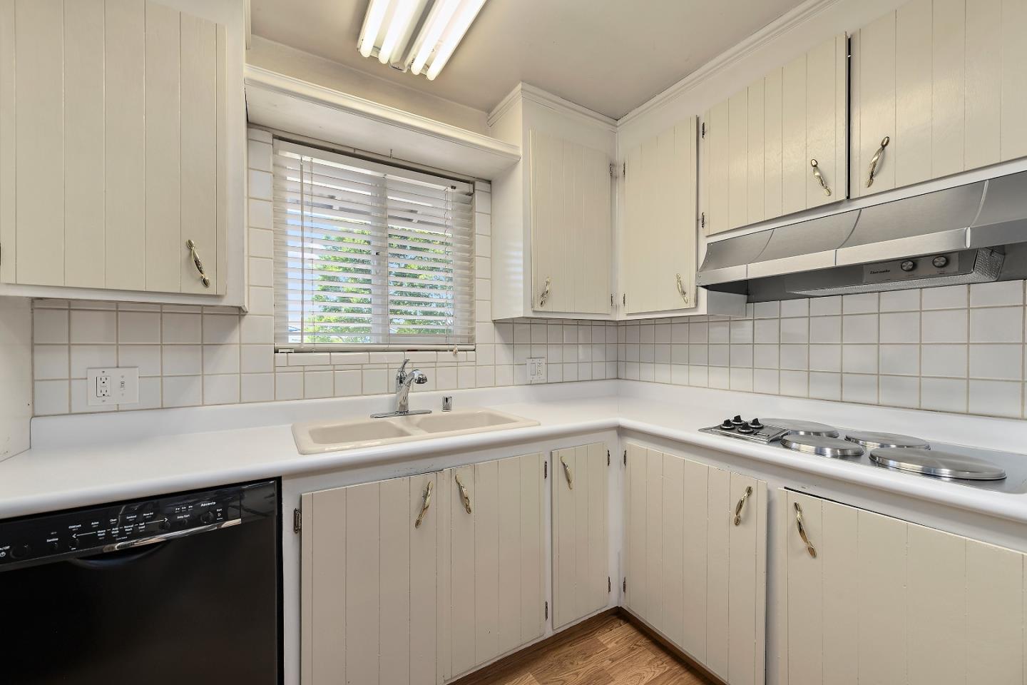 1471 Inskip Drive Campbell, CA 95008 - Photo 8 of 21 a kitchen with a sink cabinets and window