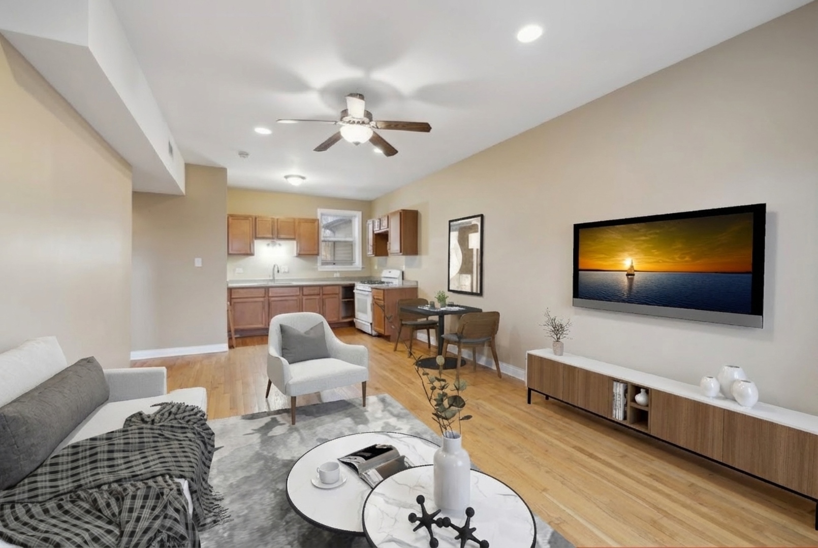 4522 South Calumet Avenue Chicago, IL 60653 - Photo 4 of 7 a living room with furniture and a flat screen tv
