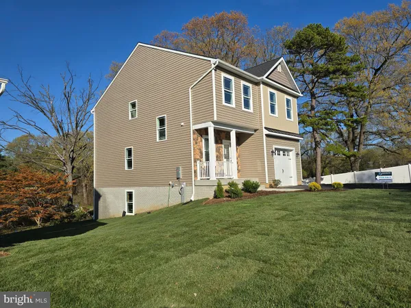 a view of a field of grass and trees