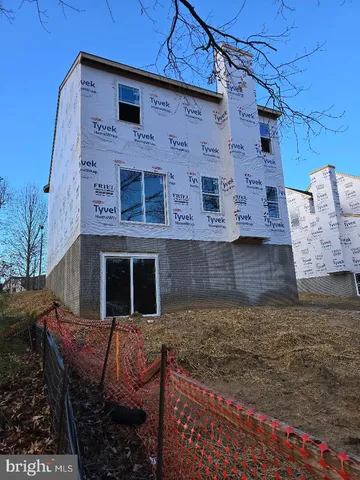 a view of a brick house with large windows