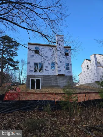 a view of a kitchen with a sink cabinets and entryway