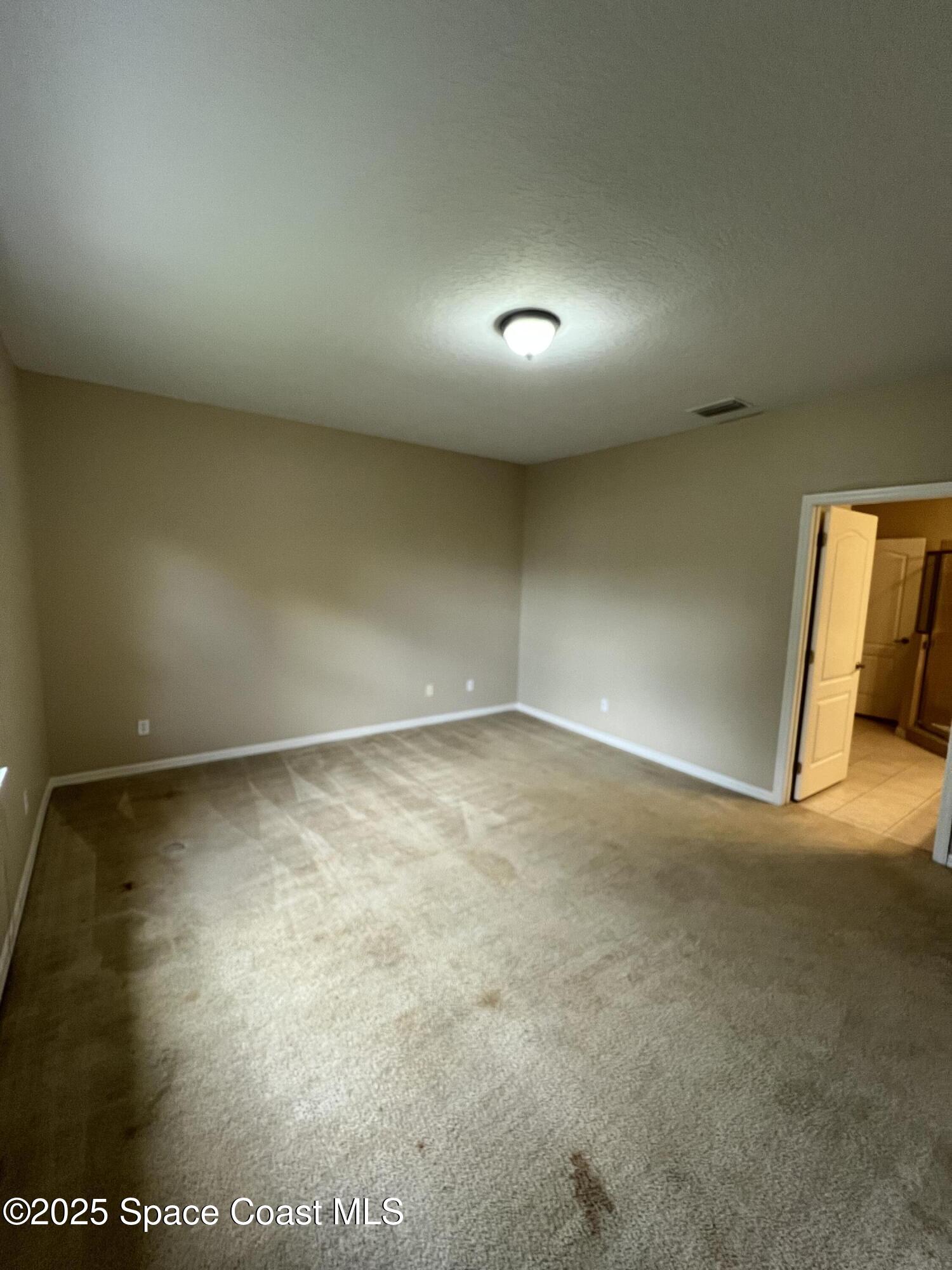 1040 Venetian Drive, Unit 203 Melbourne, FL 32904 - Photo 12 of 23 an empty room