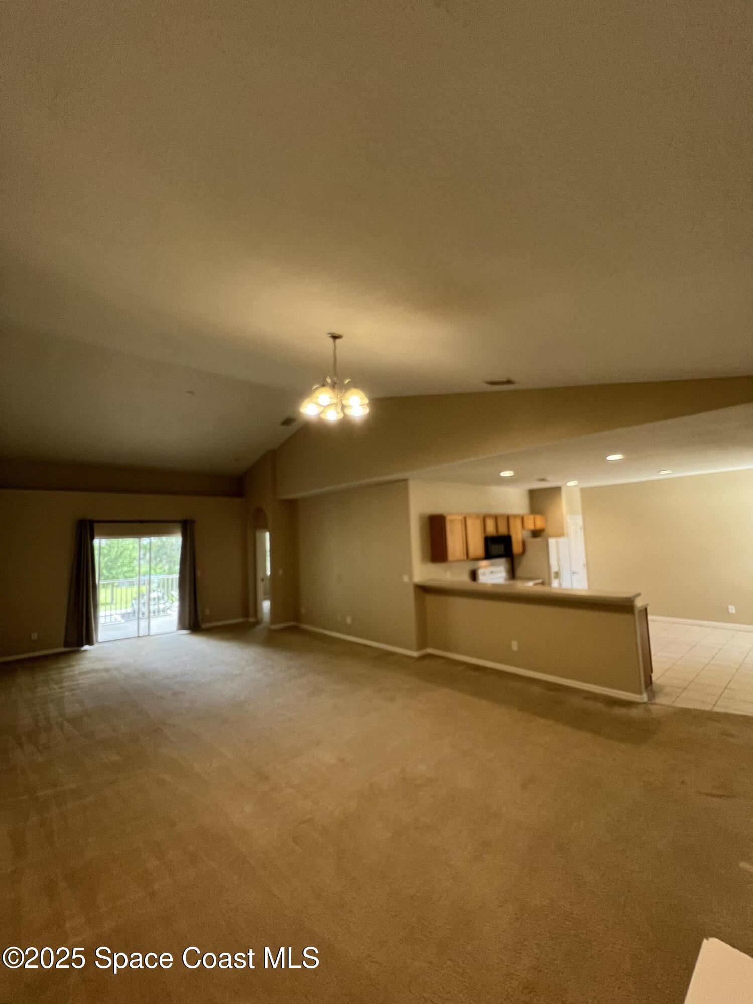 1040 Venetian Drive, Unit 203 Melbourne, FL 32904 - Photo 4 of 23 a view of a kitchen with a sink