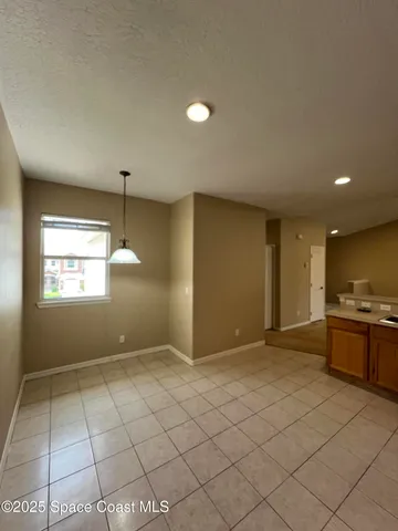 a view of balcony with furniture and garden