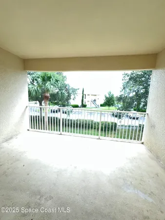 an empty room with a empty space and windows
