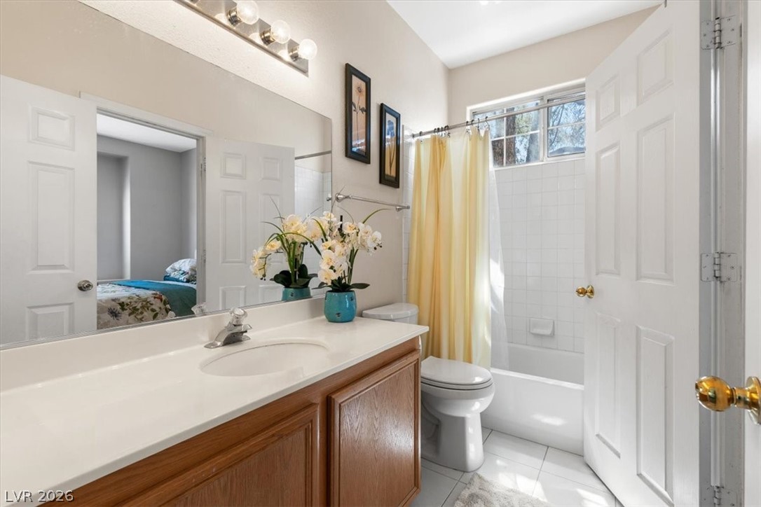 2377 Ramsgate Drive Henderson, NV 89074 - Photo 19 of 25 A well-lit bathroom with ample counter space and a full-size bathtub.