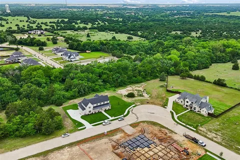 an aerial view of a house with a garden