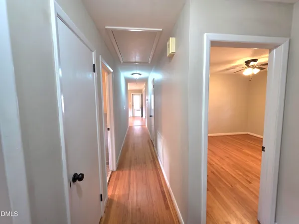 a bathroom with a glass door shower and a sink