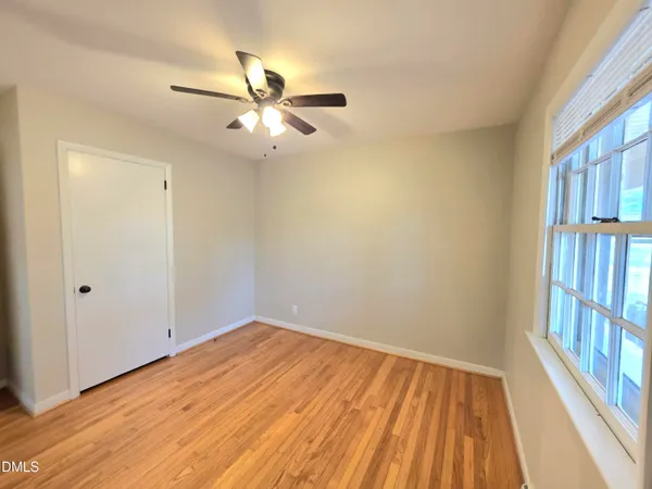 a view of a house with a yard and pathway