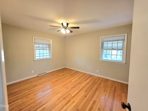 a view of a house with backyard and porch
