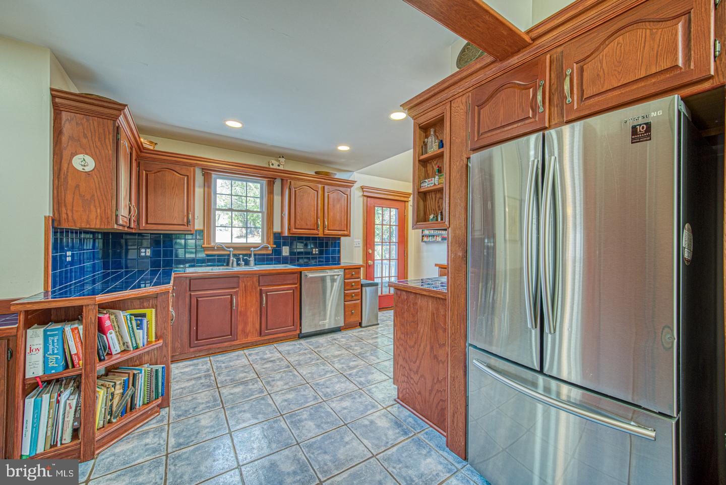 470 Farnum Road Media, PA 19063 - Photo 12 of 66 a kitchen with stainless steel appliances granite countertop a refrigerator and a wooden cabinets