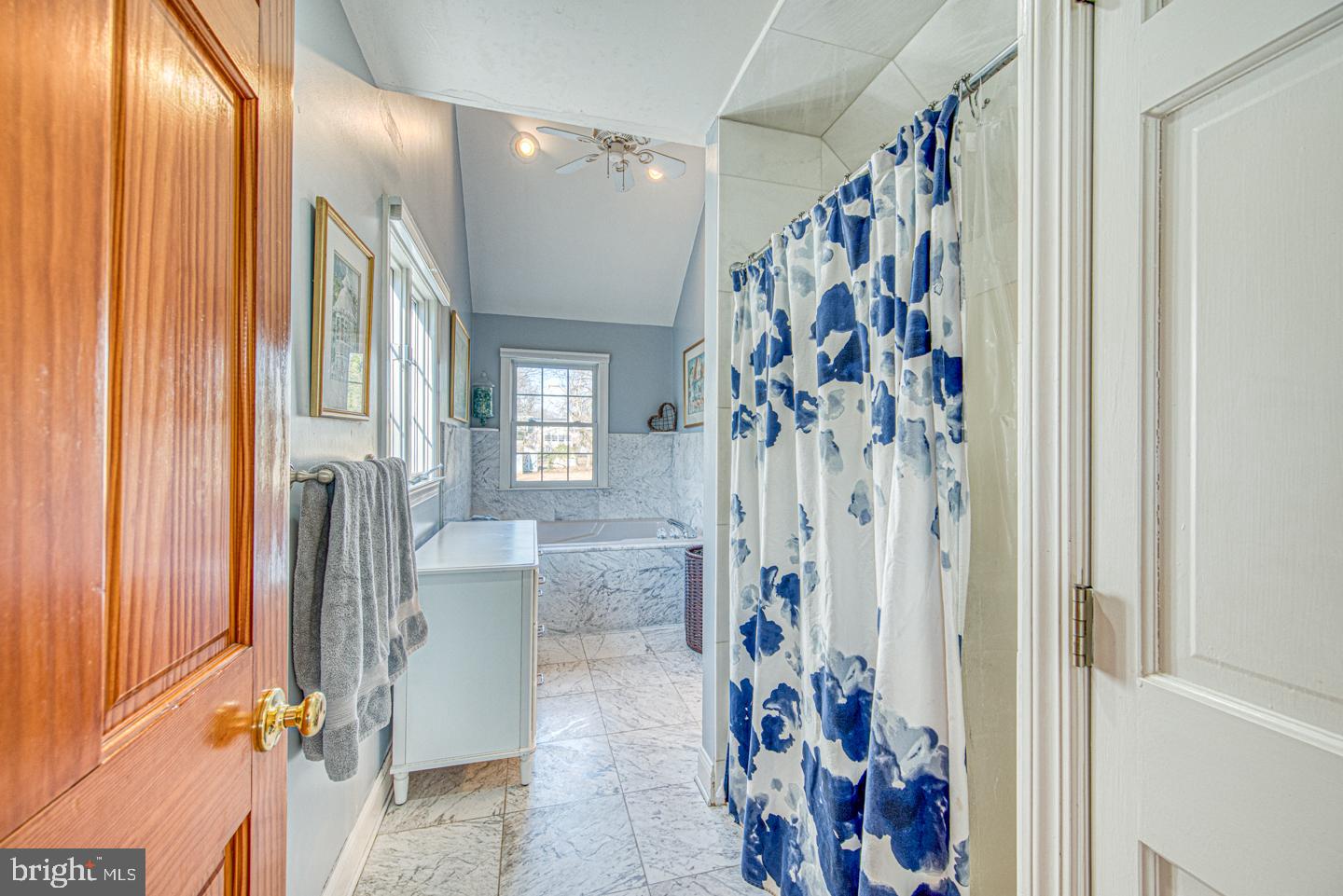 470 Farnum Road Media, PA 19063 - Photo 47 of 66 a view of a bathroom with a bathtub and a shower curtain