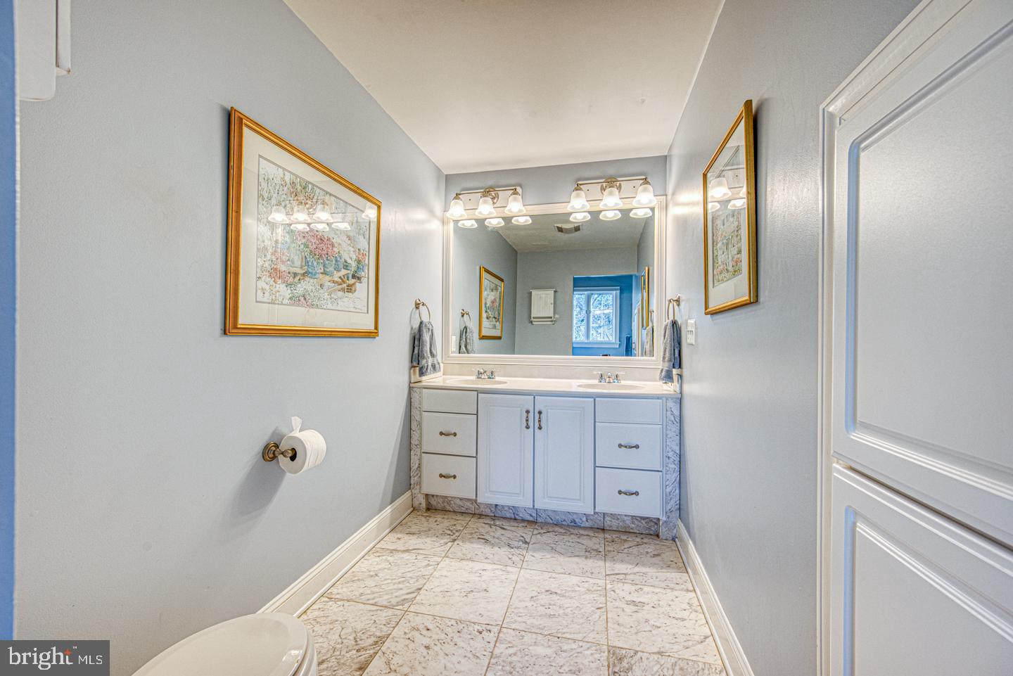 470 Farnum Road Media, PA 19063 - Photo 49 of 66 a spacious bathroom with a mirror and a sink
