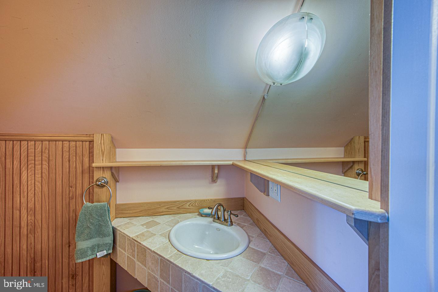 470 Farnum Road Media, PA 19063 - Photo 61 of 66 a bathroom with a sink a mirror and a shower