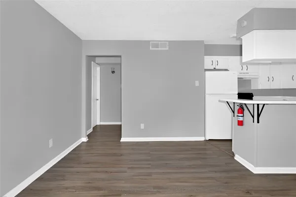 a view of kitchen with wooden floor