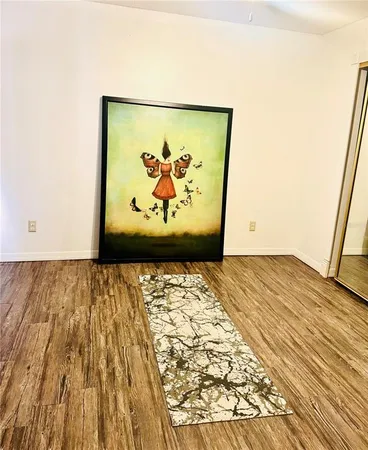 a white toilet sitting next to a shower