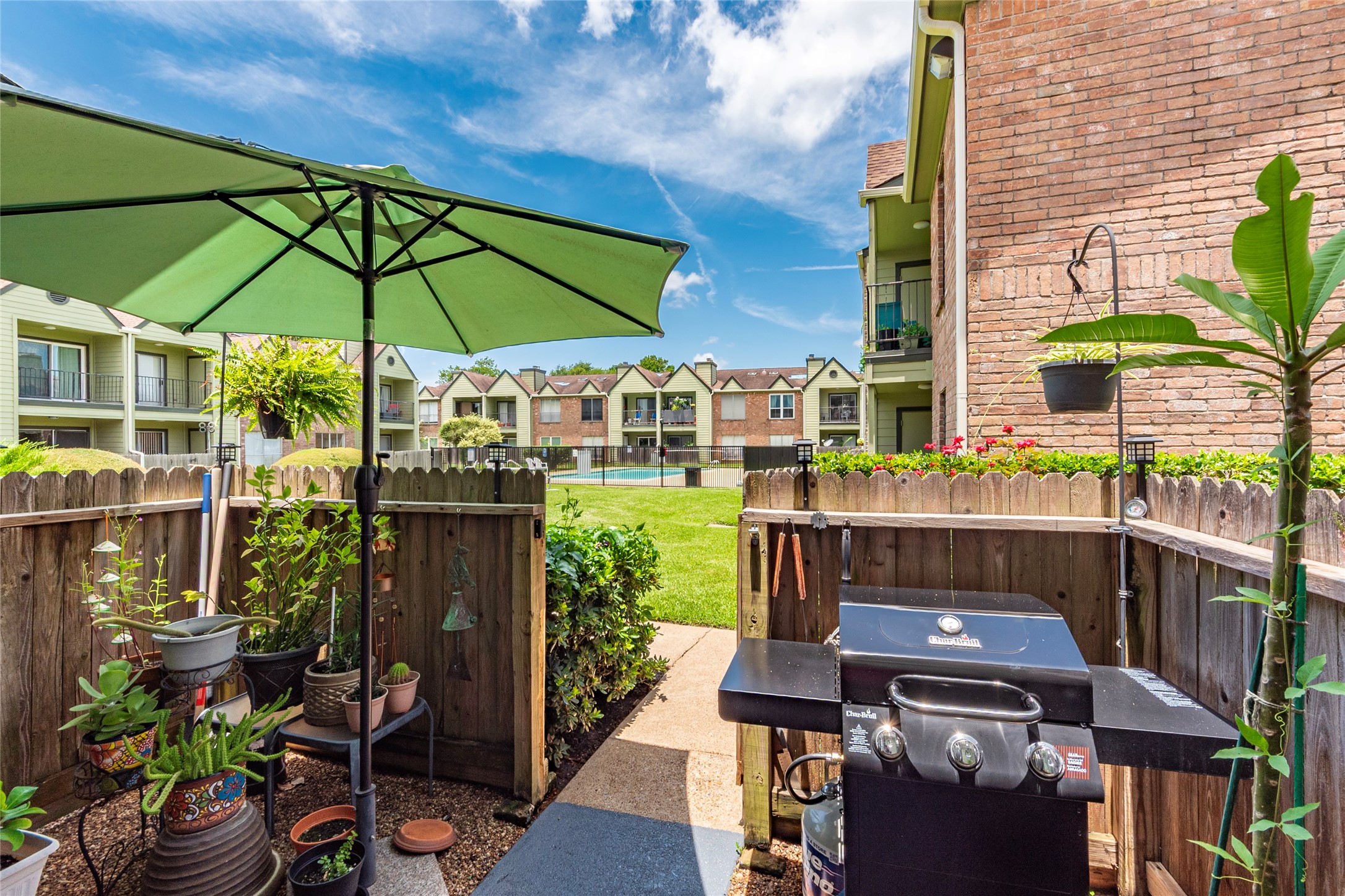 18800 Egret Bay Boulevard, Unit 1405 Webster, TX 77058 - Photo 21 of 40 Fenced and gated patio leads you to your assigned parking spaces and to the pool area