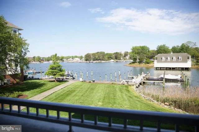 a view of a lake with houses in the back