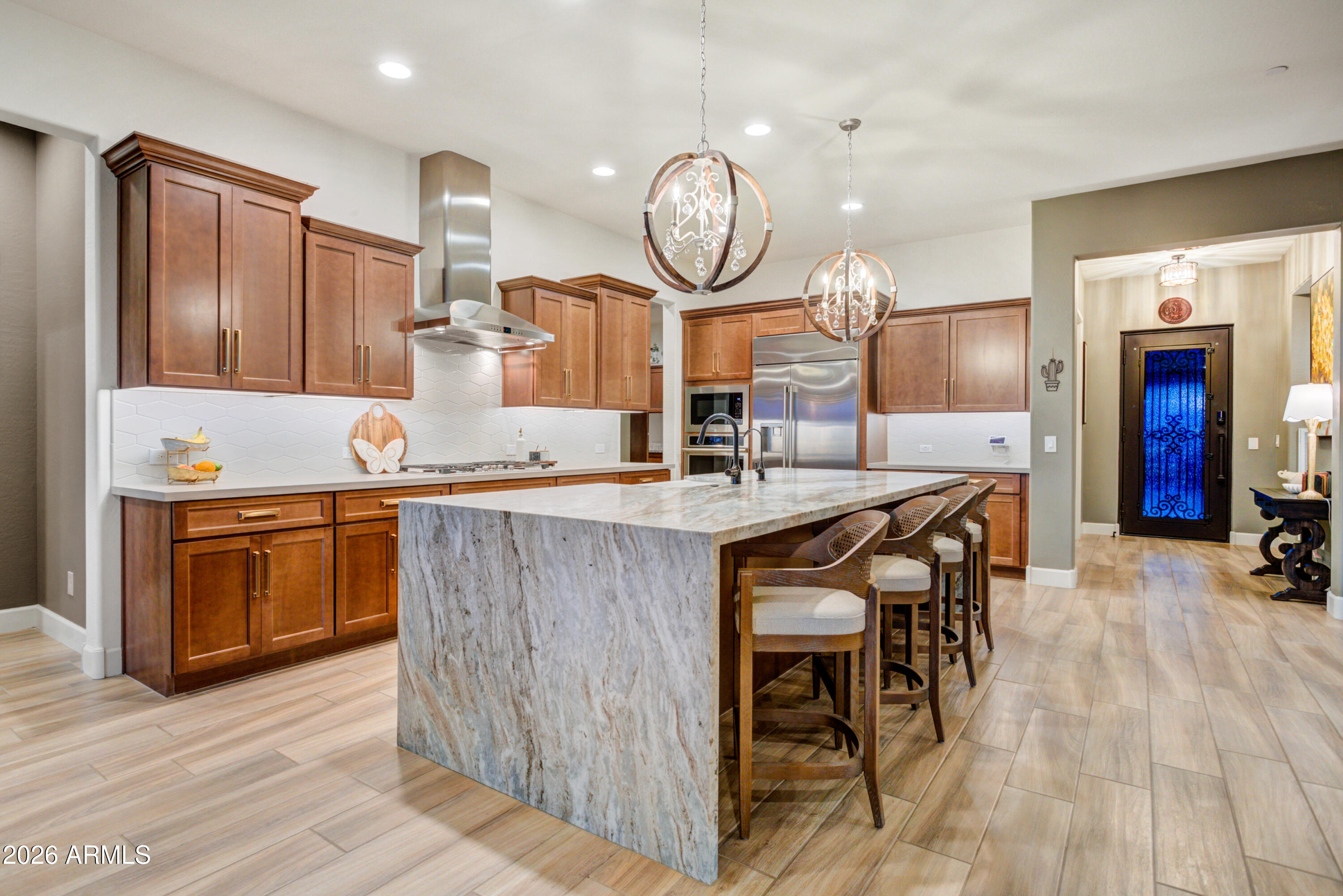 28517 North Camel Rock Court Rio Verde, AZ 85263 - Photo 9 of 39 a very nice looking kitchen with granite countertop a stove a oven a dining table and chairs