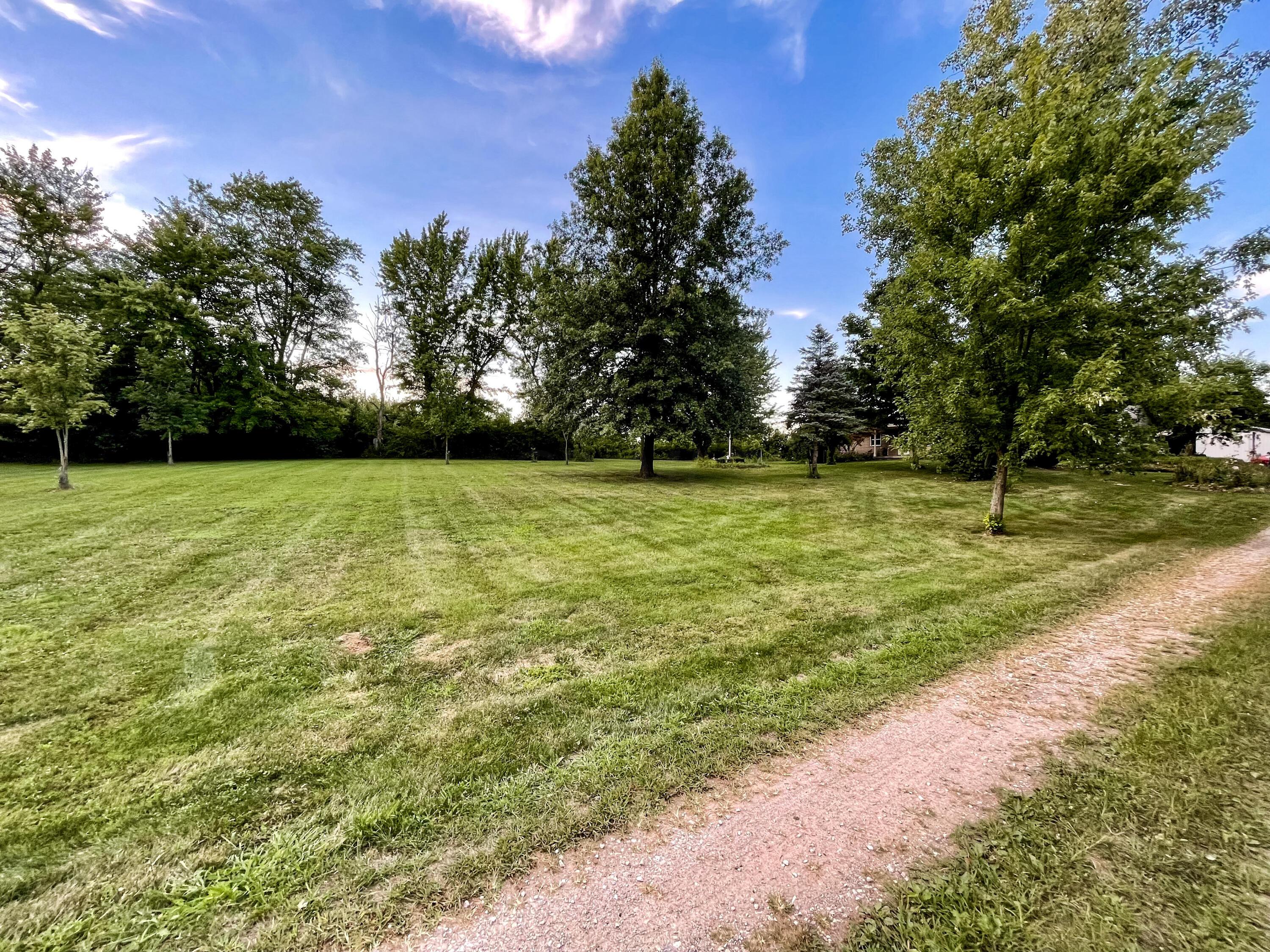 10671 Co Road East Liberty, OH 43319 - Photo 9 of 37 View heading to the house and barn