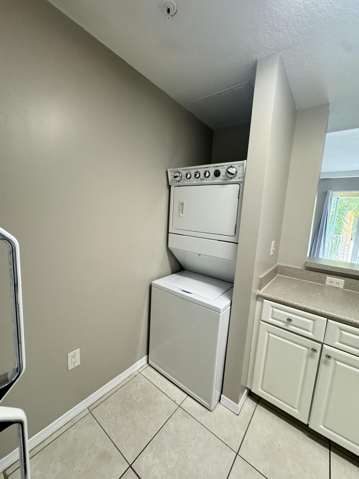 1203 Town Center Drive, Unit 306 Jupiter, FL 33458 - Photo 11 of 21 a utility room with dryer and washer