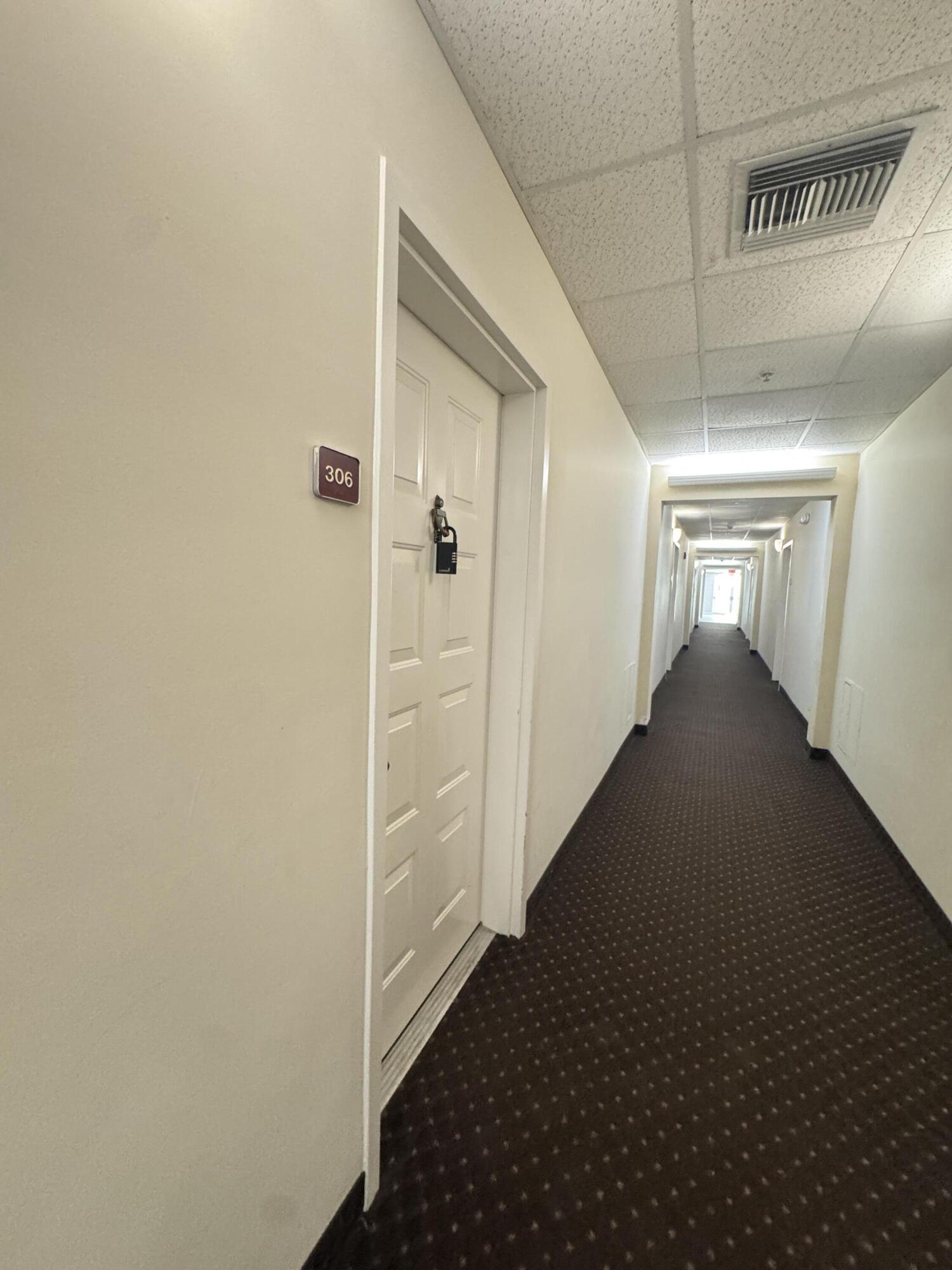 1203 Town Center Drive, Unit 306 Jupiter, FL 33458 - Photo 17 of 21 a view of hallway