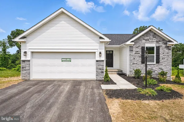 a front view of a house with garage
