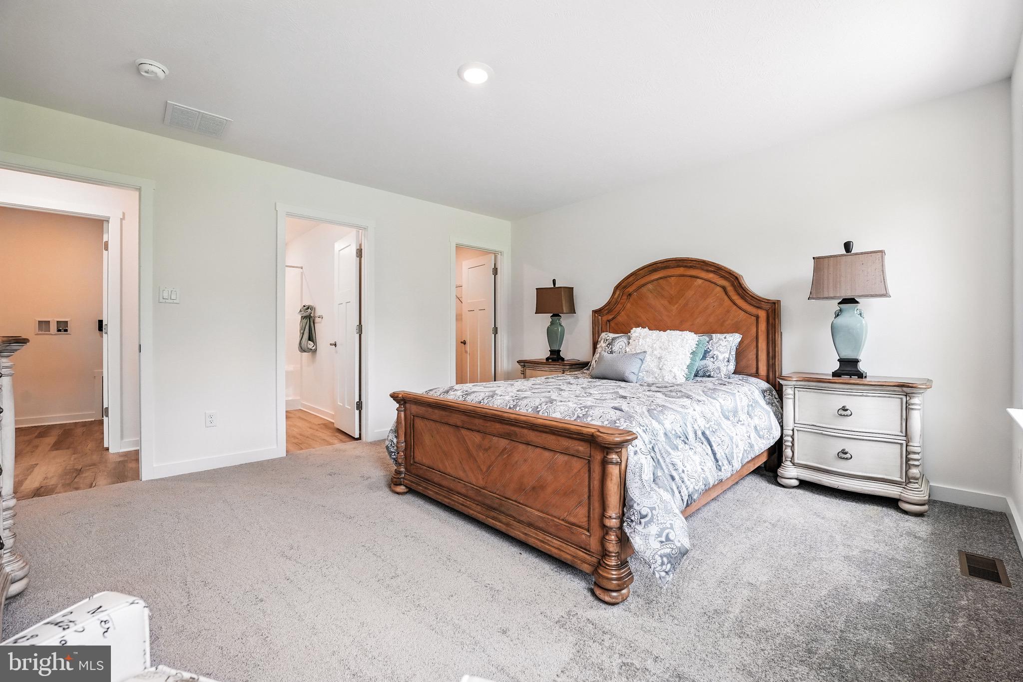 3 Thornton Avenue Ranson, WV 25438 - Photo 28 of 31 a spacious bedroom with a bed and a dresser