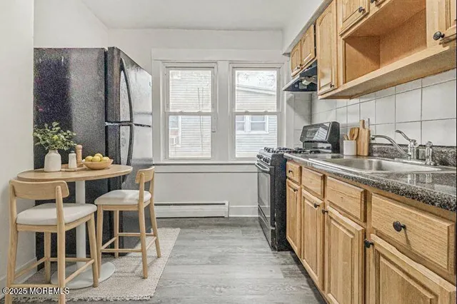 a kitchen with granite countertop furniture and a window
