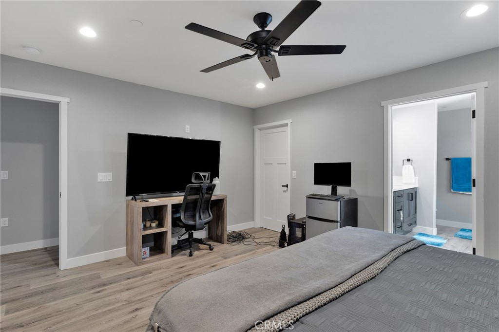 21533 Del Oro Road Apple Valley, CA 92308 - Photo 14 of 35 a bedroom with a bed and a flat screen tv