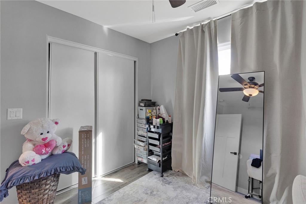 21533 Del Oro Road Apple Valley, CA 92308 - Photo 20 of 35 a bedroom with a bed and a window