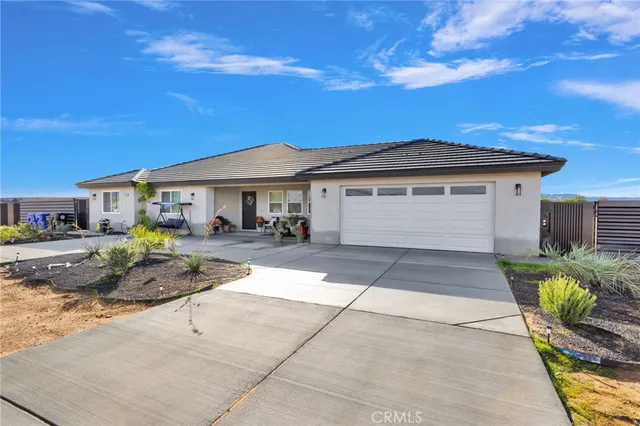 a front view of a house with patio