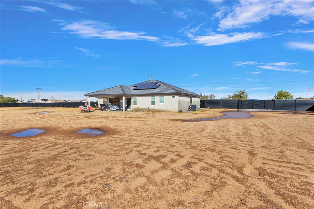 21533 Del Oro Road Apple Valley, CA 92308 - Photo 25 of 35 a bathroom with a swimming pool lake and yard in the back