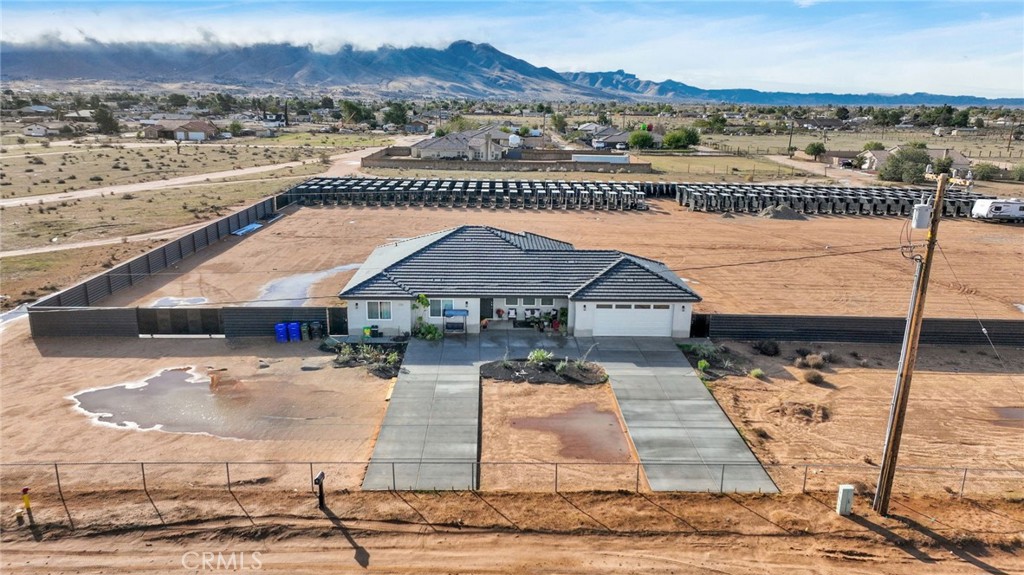 21533 Del Oro Road Apple Valley, CA 92308 - Photo 27 of 35 a view of a house with a yard