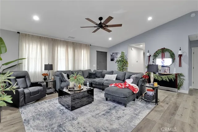 a living room with furniture window and potted plant
