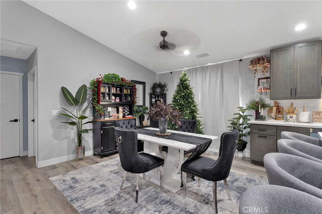 21533 Del Oro Road Apple Valley, CA 92308 - Photo 7 of 35 a kitchen with stainless steel appliances kitchen island granite countertop a sink and a refrigerator