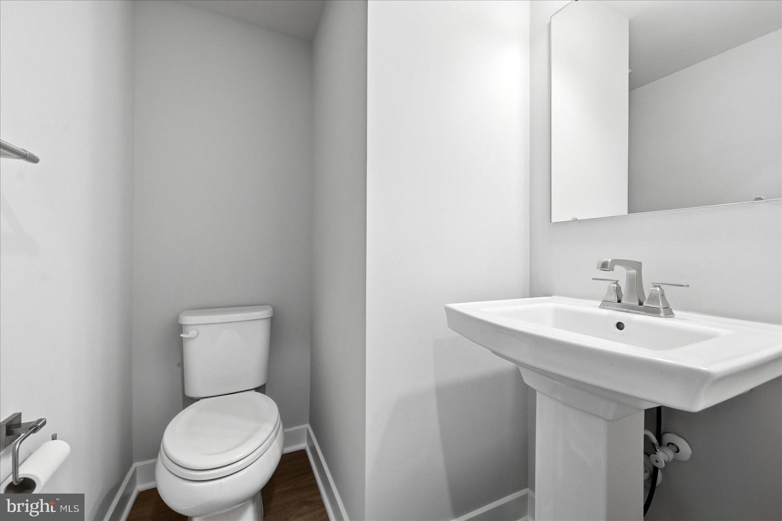 14380 Longhouse Loop Brandywine, MD 20613 - Photo 13 of 20 a bathroom with a toilet a sink and a mirror