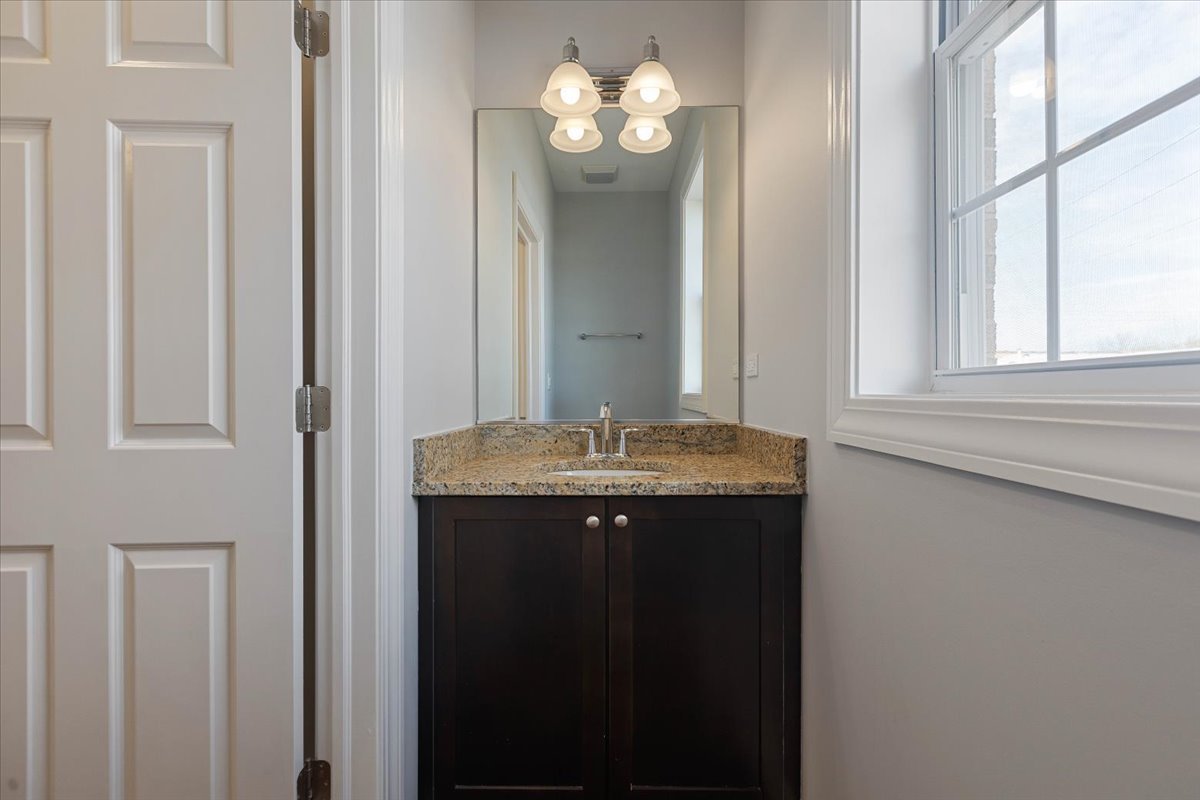 1669 Church Street Evanston, IL 60201 - Photo 11 of 31 a bathroom with a sink and a mirror