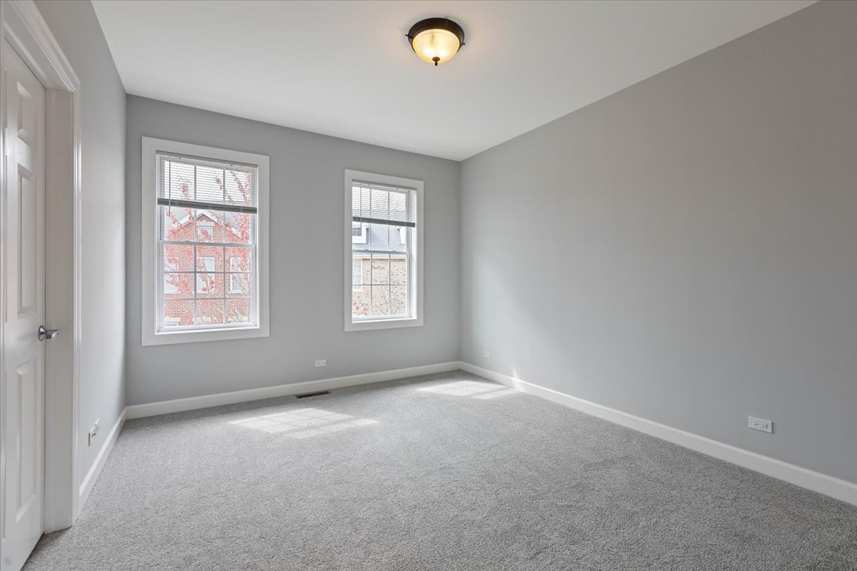 1669 Church Street Evanston, IL 60201 - Photo 13 of 31 a view of an empty room with a window