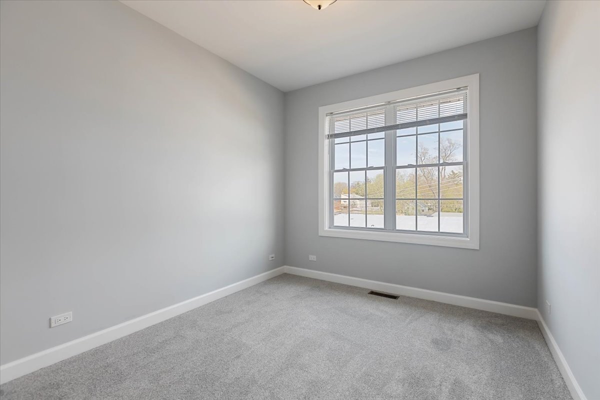 1669 Church Street Evanston, IL 60201 - Photo 19 of 31 an empty room with a window