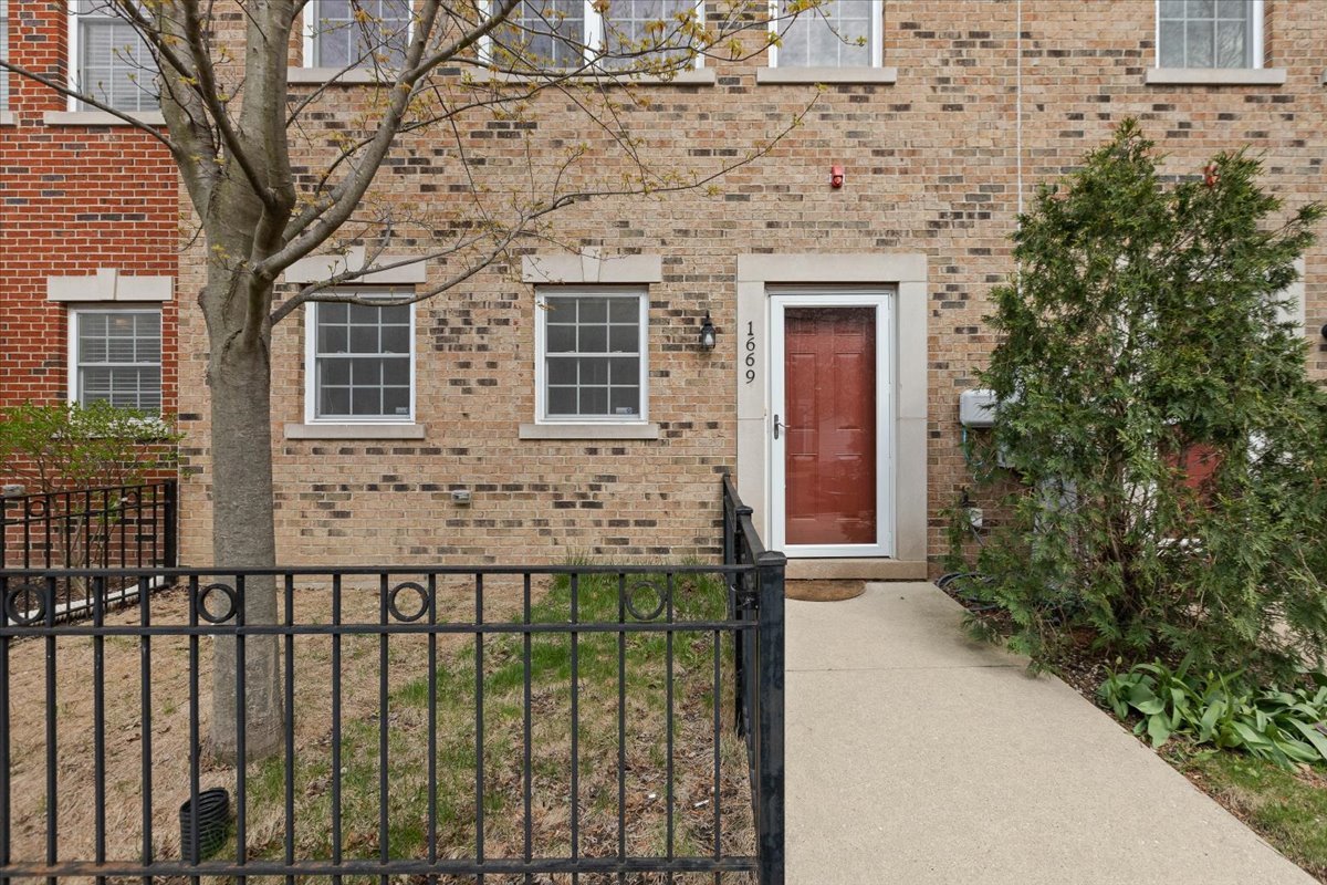 1669 Church Street Evanston, IL 60201 - Photo 2 of 31 a front view of a house with a garden